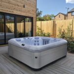 AquaSolus Brook hot tub in a garden