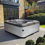 AquaSolus Cove hot tub in a garden