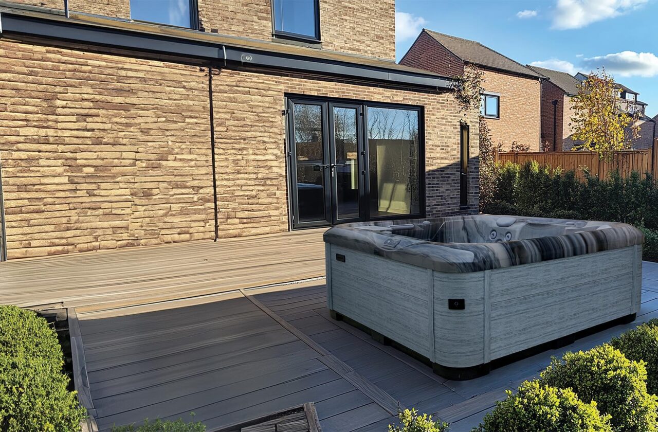 AquaSolus Cypress hot tub in a garden